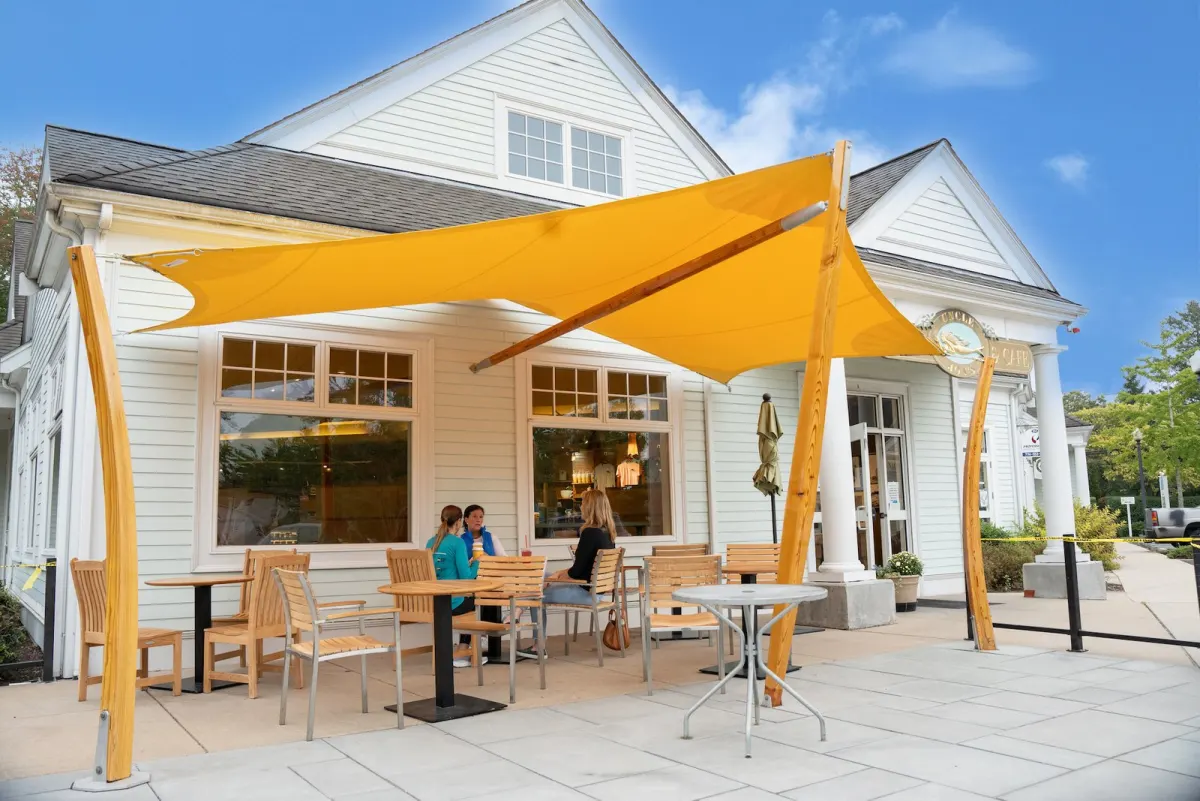Uncle Jon's cafe in Marion with its yellow sail shade and patio
